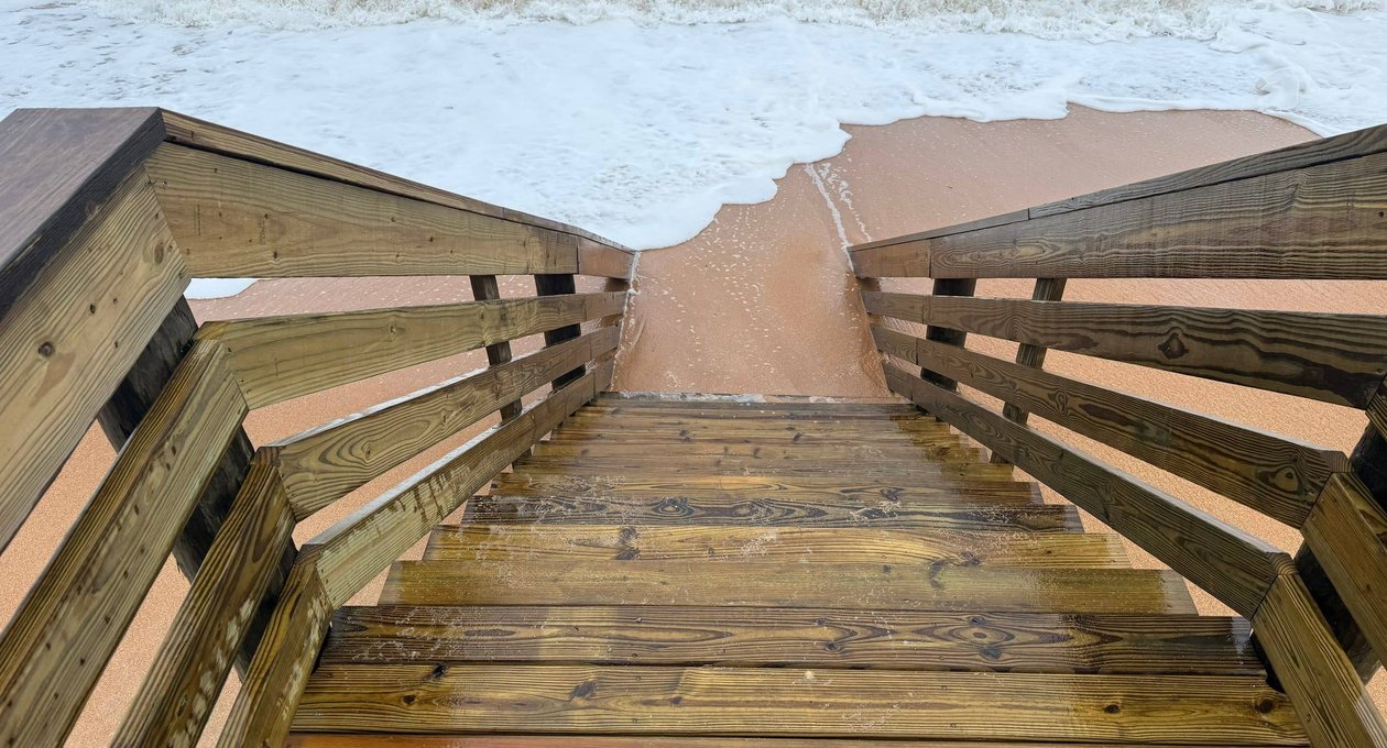 Marina dock with boats and covered slips