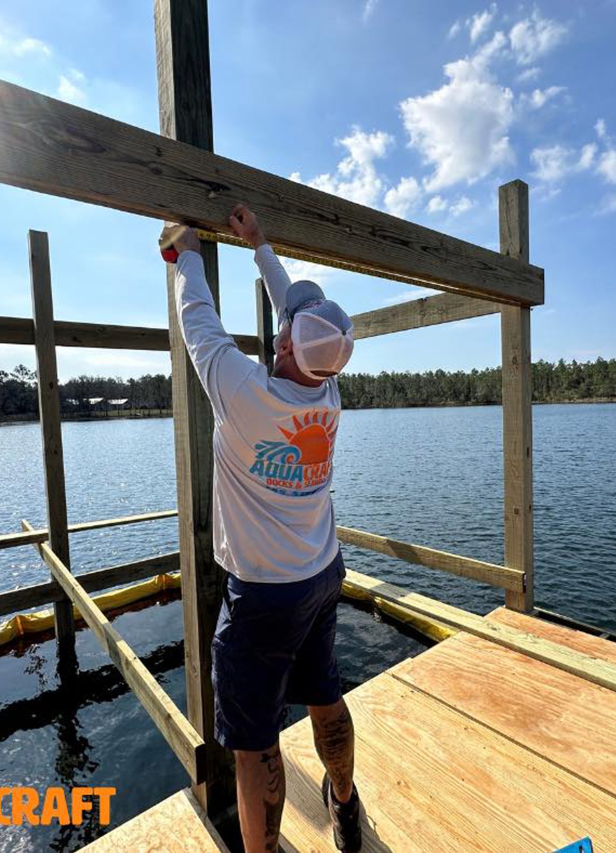Close-up view of dock pilings over calm water